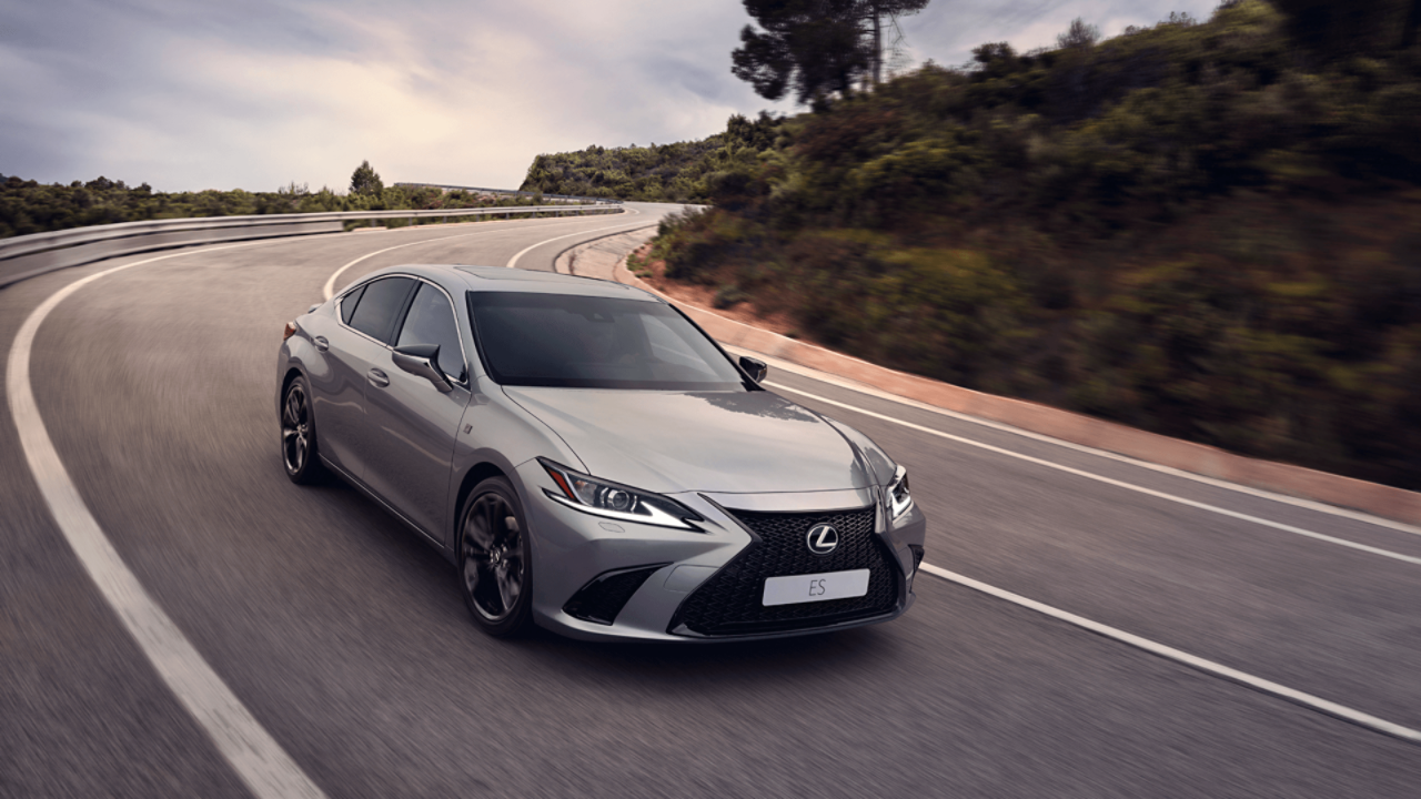 A Lexus ES driving on a road