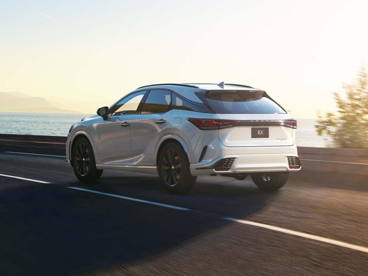 A Lexus RX driving on a coastal road