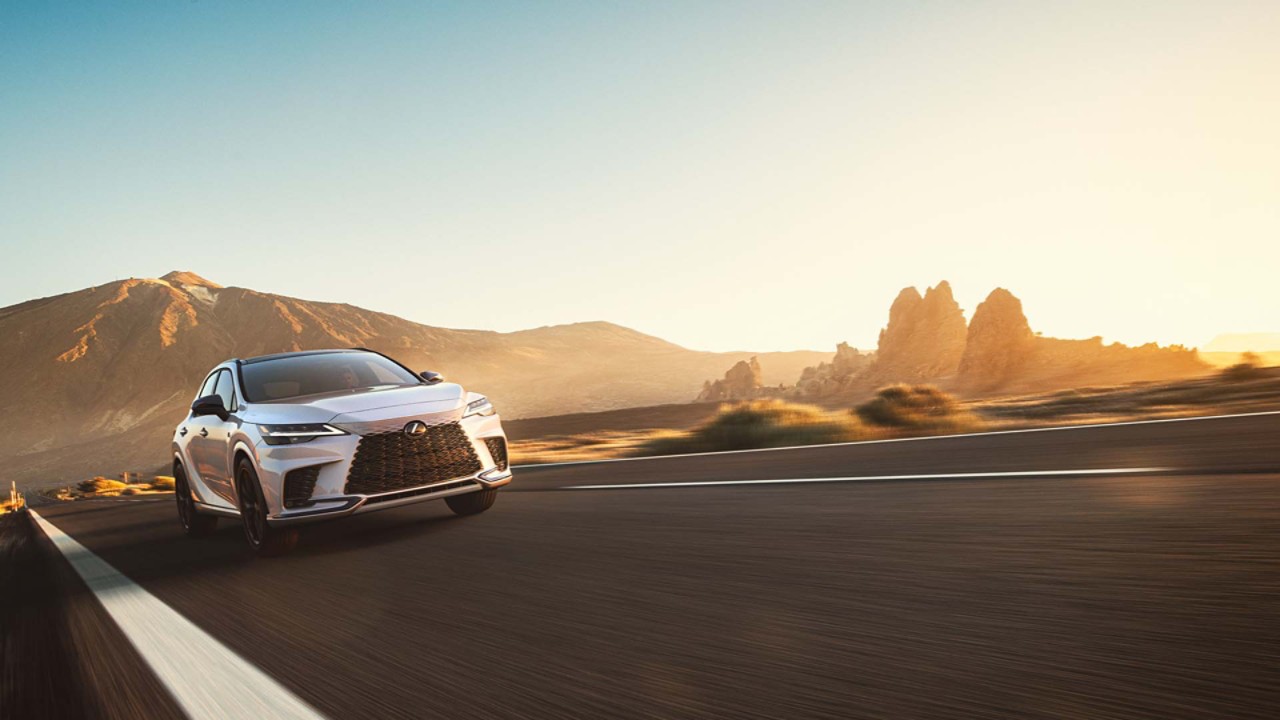 A Lexus RX driving on a road